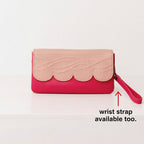 Light pink and hot pink wallet on a white background