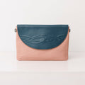 Leather Clutch Hybrid: from coffee runs to cocktails.