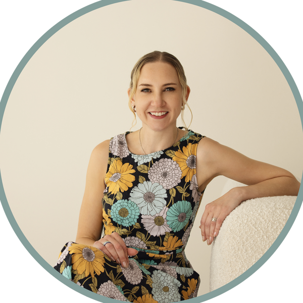 Helen, founder of pili pala pieces. sitting on a chair for a portrait photo