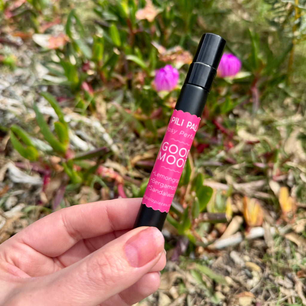 Fragrance for felt flowers. Black spray bottle with pink label. Good Mood scent.