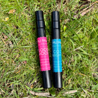 2 black spray bottles containing fragrance for felt flowers. Good Mood scent. Cozy nights scent
