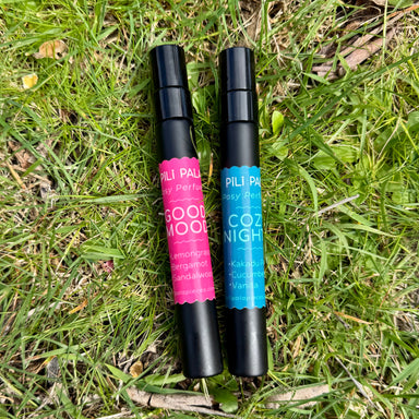 2 black spray bottles containing fragrance for felt flowers. Good Mood scent. Cozy nights scent
