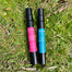 2 black spray bottles containing fragrance for felt flowers. Good Mood scent. Cozy nights scent